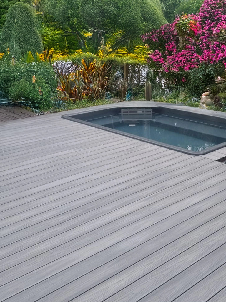4 Everdeck Ash Grey composite decking around a modern swimming pool – low-maintenance, weather-resistant outdoor decking