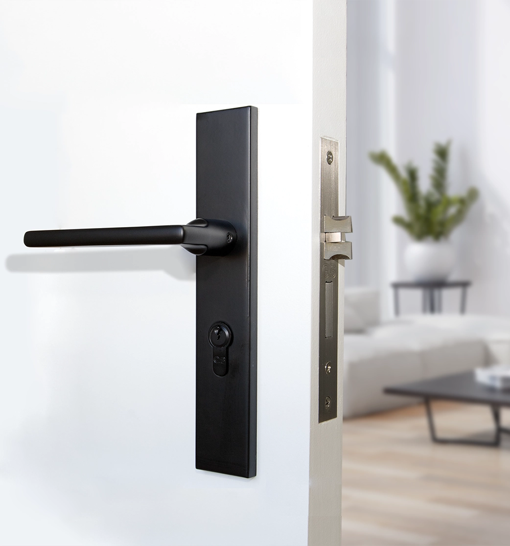 Black stainless steel door handle fitted to a white interior door – modern matte finish by Doors Direct."