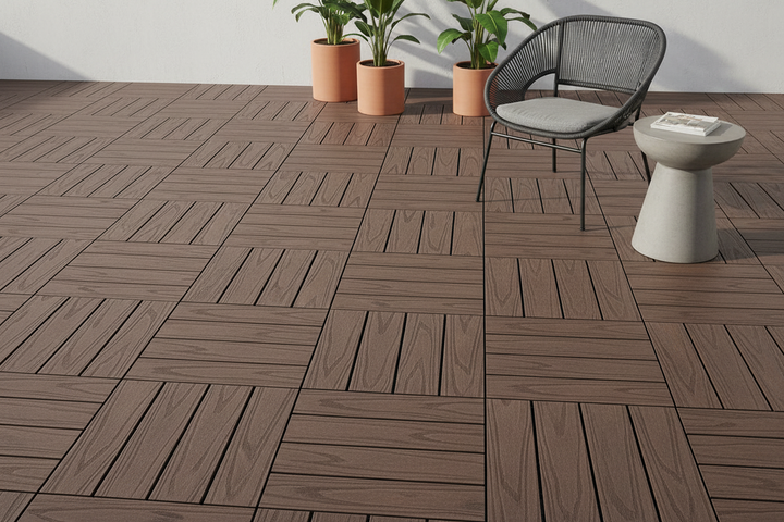 Redwood DIY Decking Tiles arranged in a checker board pattern with a chair and plants in the background.