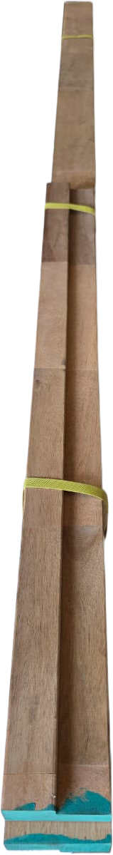 Close-up top view of unassembled hardwood door jamb sections showing the rebates and finger-jointed wood grain detail.