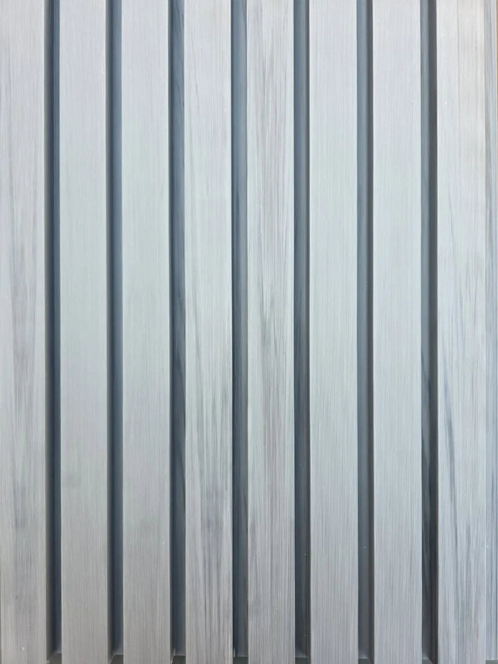 Close-up of 4 Everdeck® Grey Ultra Fluted PVC wall panels showing deep vertical grooves and timber-look texture.