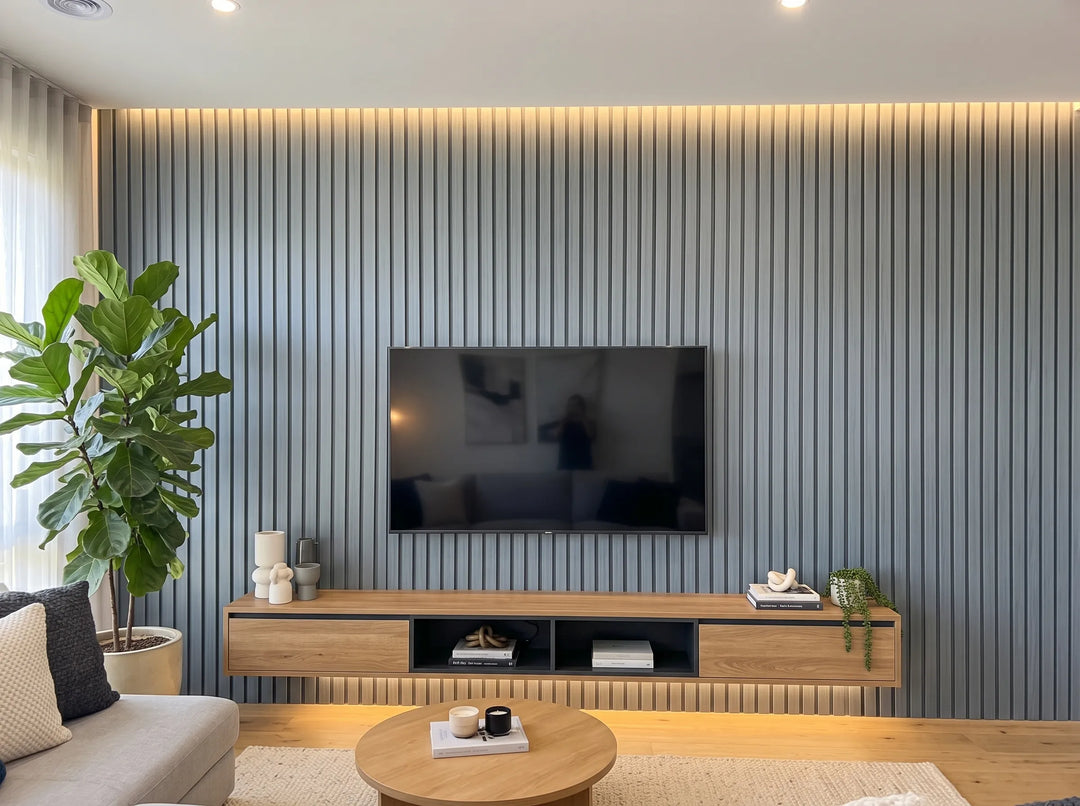 4 Everdeck® Grey Ultra Fluted PVC wall panels forming a lounge TV feature wall with warm accent lighting.