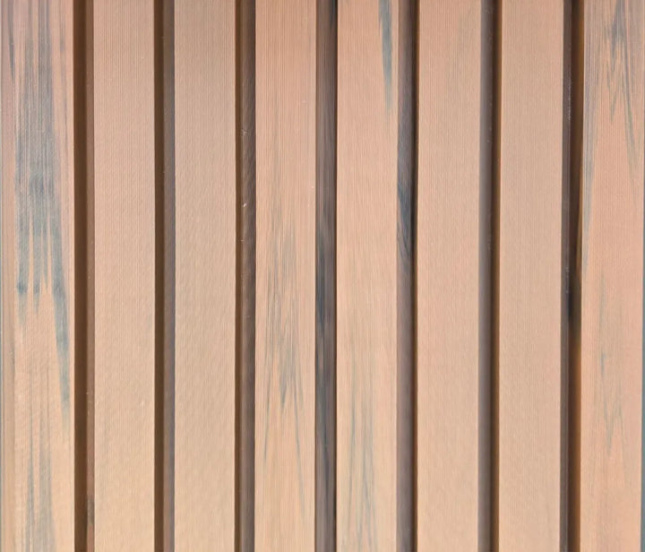 Close-up of 4 Everdeck® Rosewood Ultra Fluted PVC wall panels showing deep vertical grooves and timber-look texture.