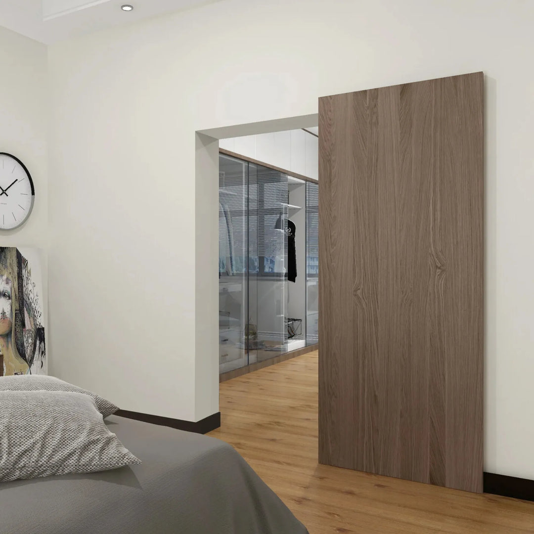 Ghost Sliding Door American Walnut installed in bedroom doorway leading to walk-in closet, fully concealed track system