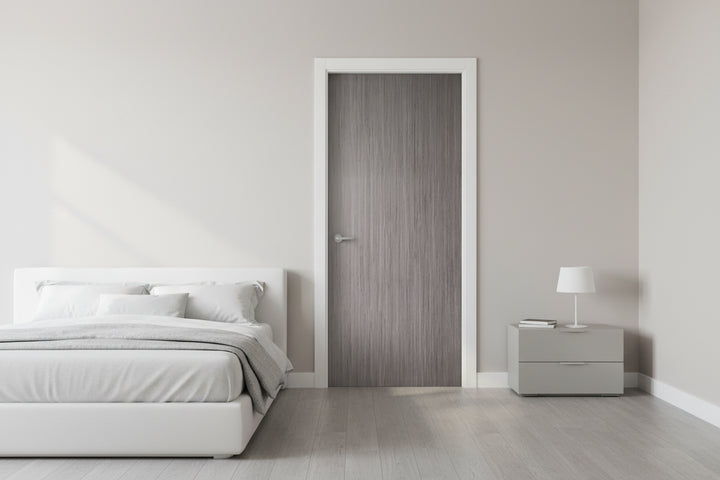 door in a door frame and show the door in the door frame in a closed position with a modern bedroom in the foreground