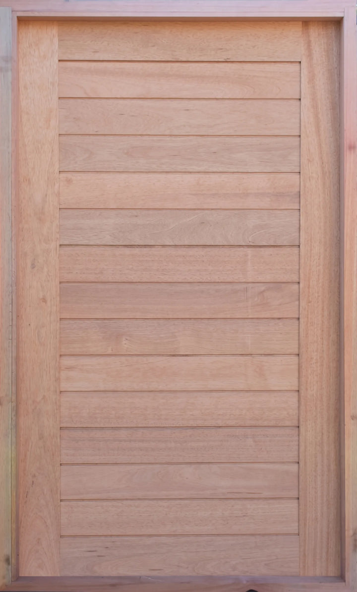 Solid meranti horizontal slatted pivot door pre-hung in frame, supplied raw and untreated, 1500mm x 2400mm, showing natural timber grain and frame.