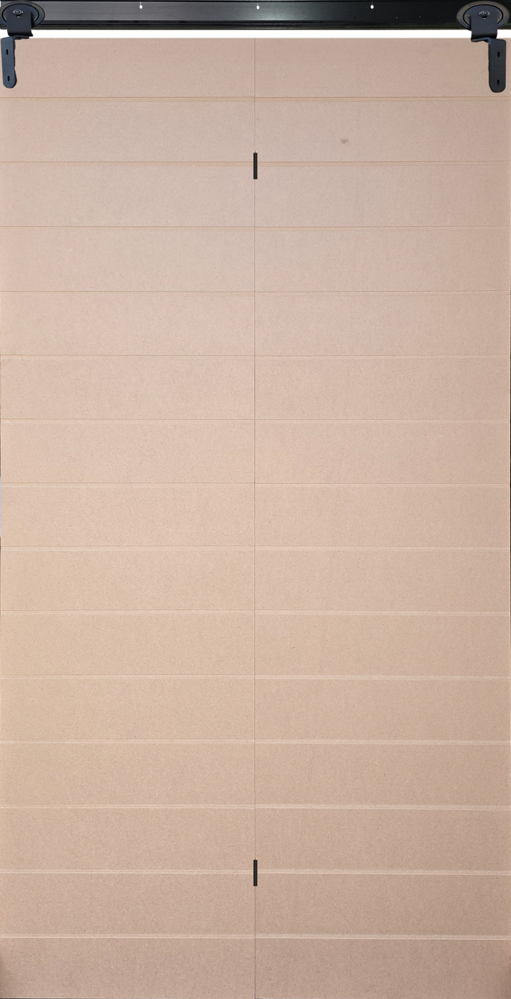 Closed view of economy 14-groove bi-fold barn door with black hardware.